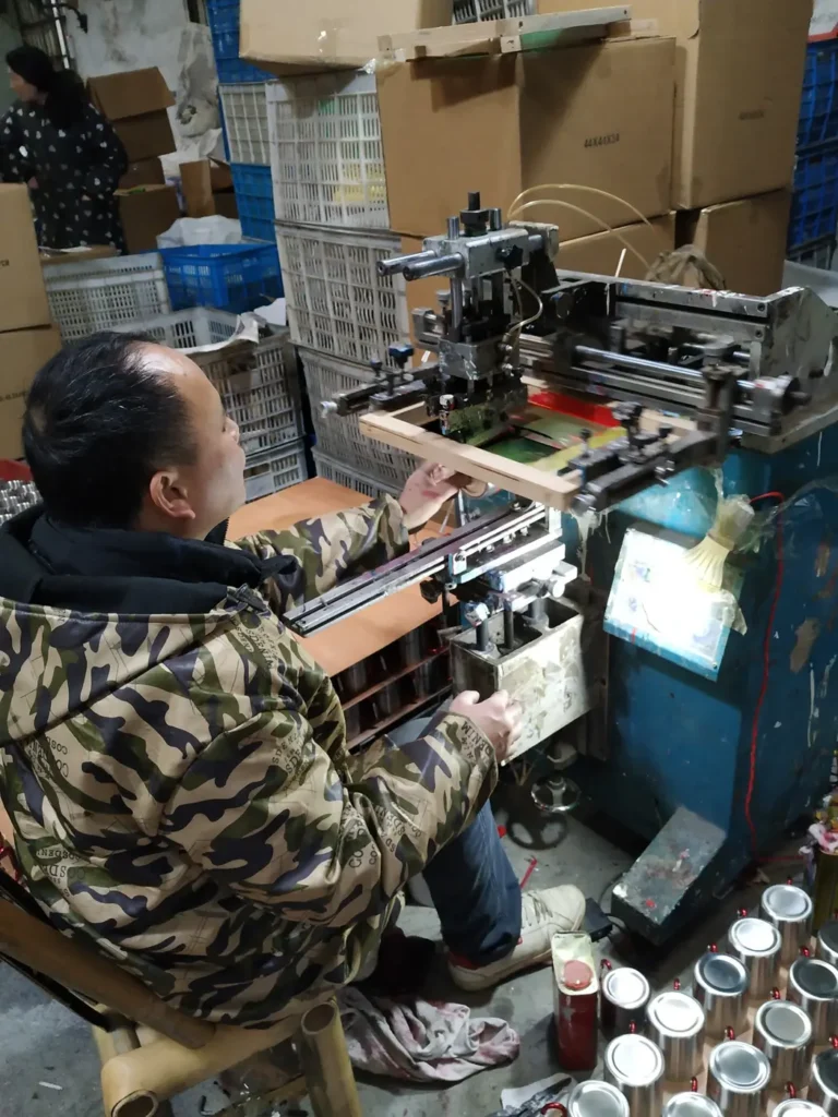 Screen printing custom logos on stainless steel mugs