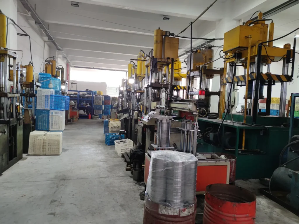 Deep drawing machines forming stainless steel mug bodies
