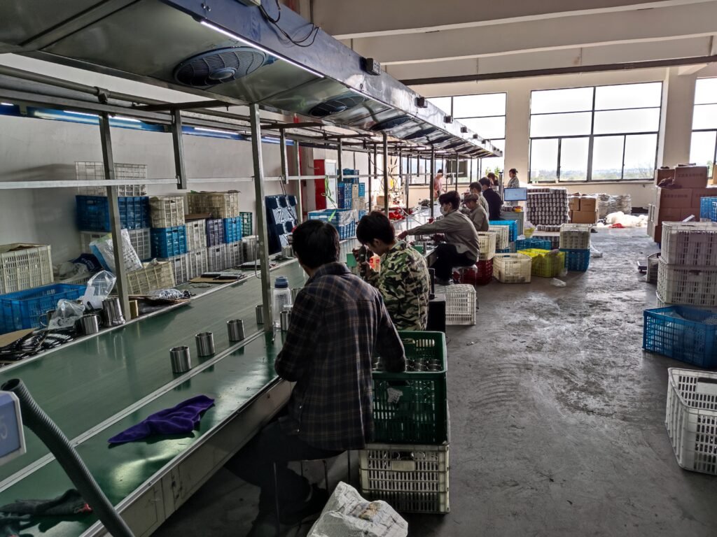 Stainless steel drinkware cleaning and pre-packing inspection area